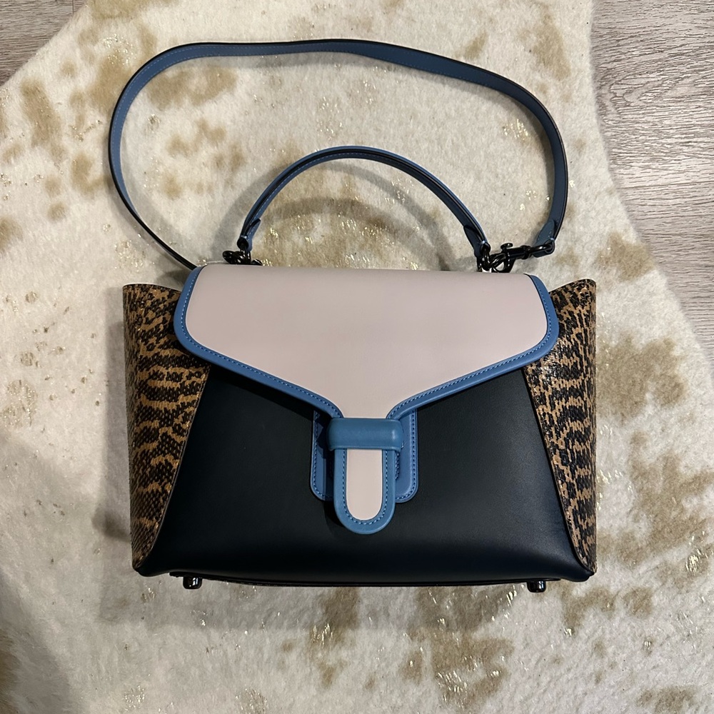 Black and Cream Satchel with Structured Shape and Flap Design